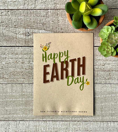 A brown seed packet that says "Happy Earth Day," with flowers blooming from the H and Y.