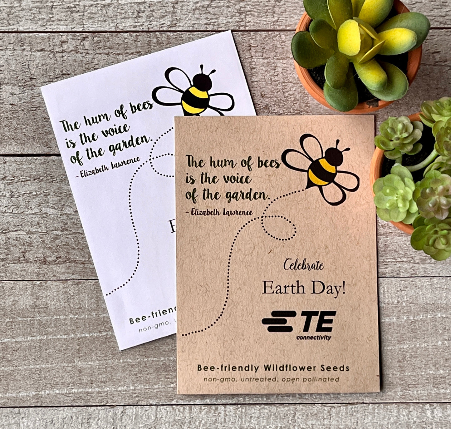 A white and brown seed packet with a drawing of a buzzing bee and a quote about bees.