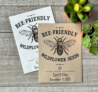 A white and a brown seed packet that has a large line drawing of a bee and the words "bee-Friendly."